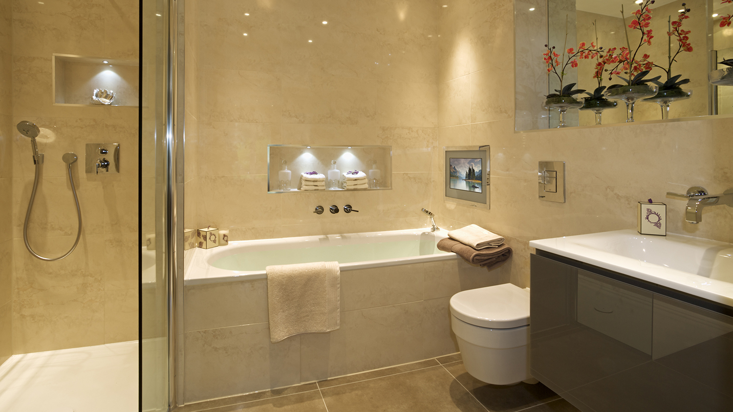 beige relaxing bathroom with built in tv     